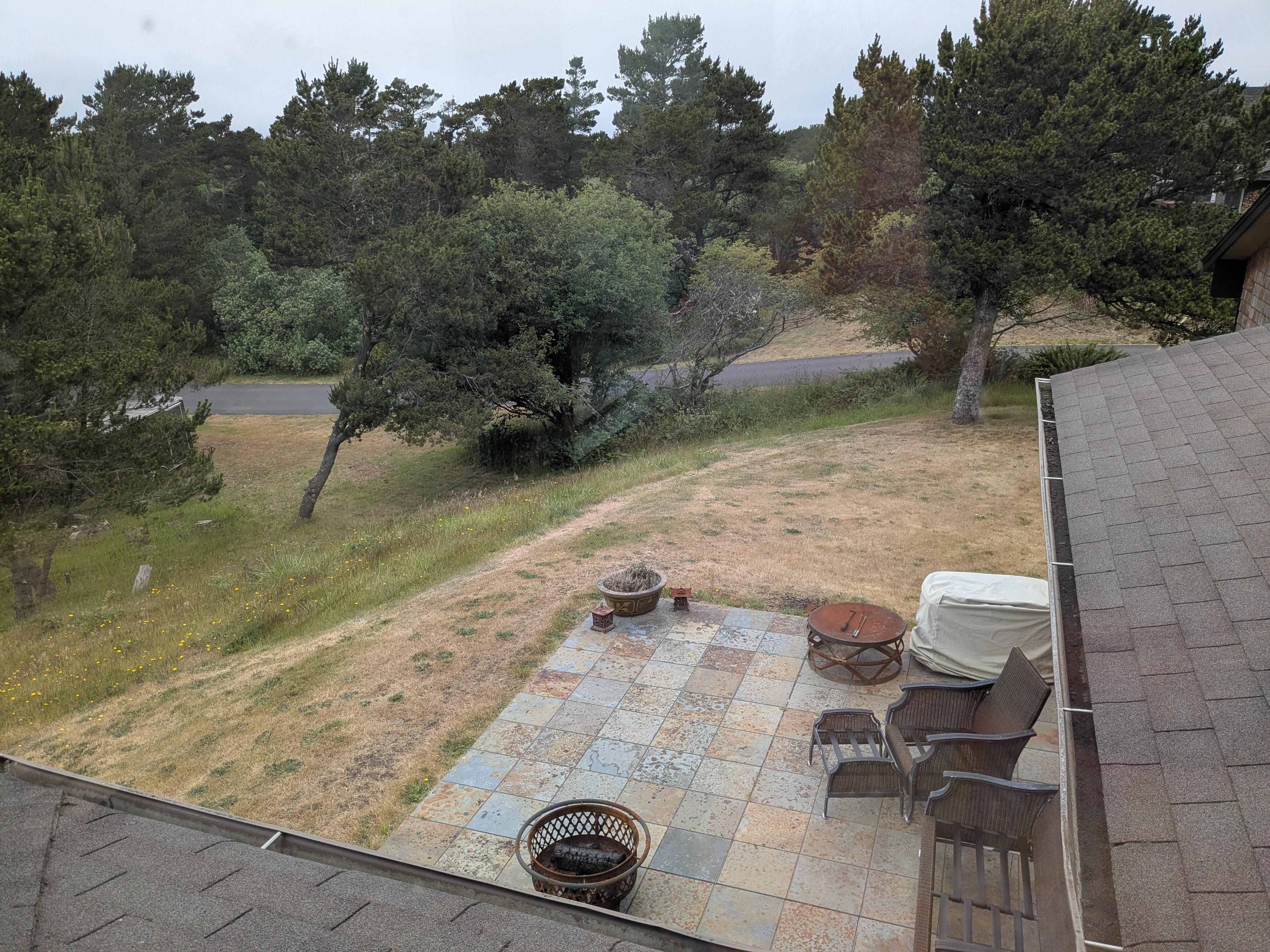 View from upstairs of the patio and surrounding yard