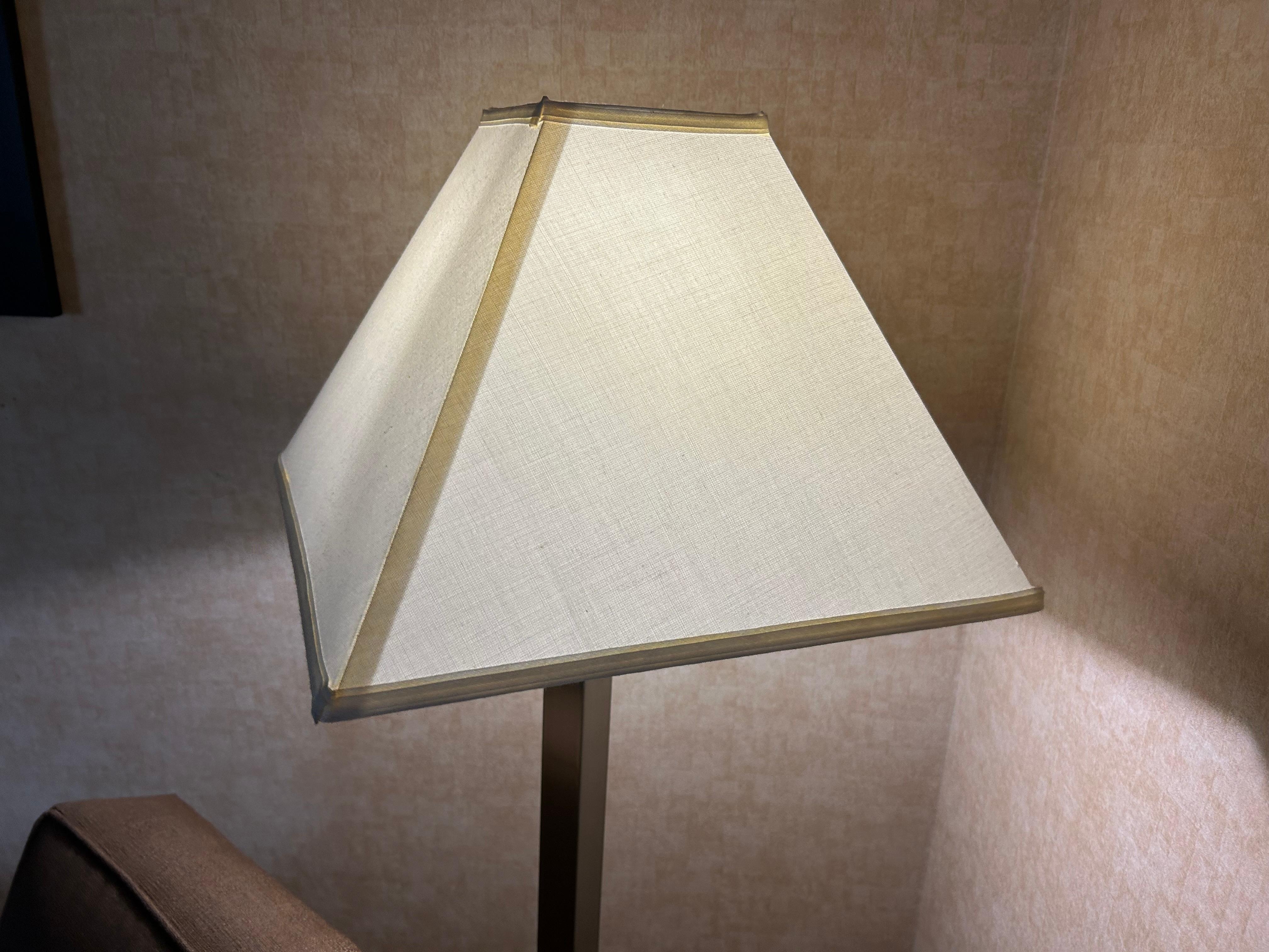 Torn lampshade that rocks back and forth