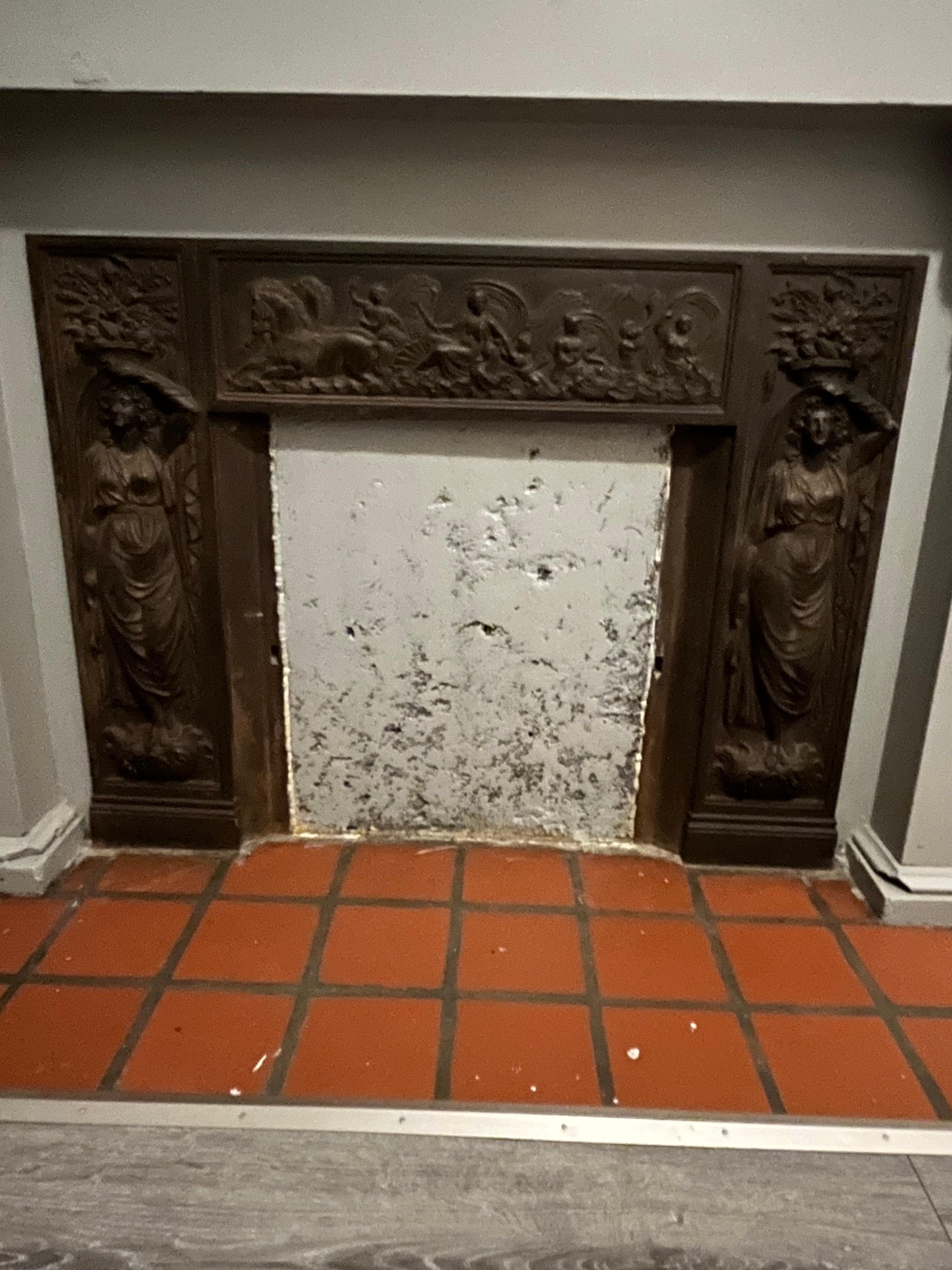 A lovely mantelpiece frieze, most likely an original fixture. 