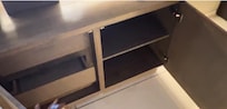 Cabinets below TV