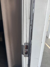 Appeared like door was forced and never fixed.