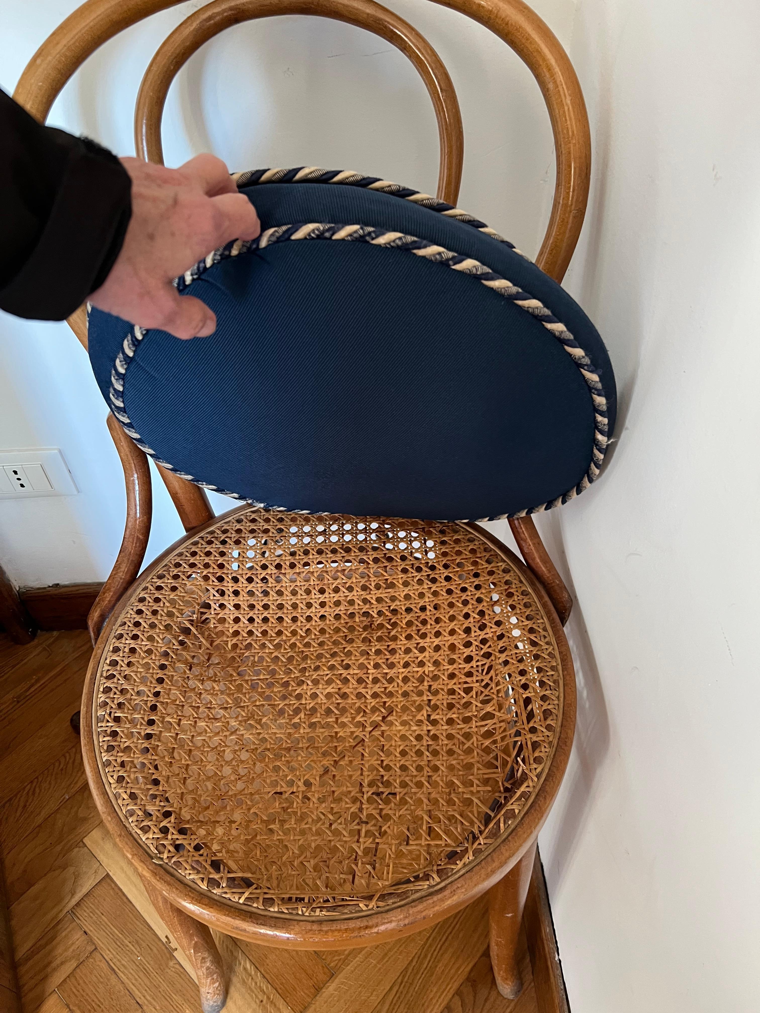 Chair that is breaking at the dining table.