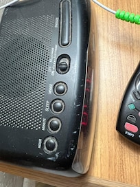 Years of filth on the alarm clock completes the rest of the undusted room