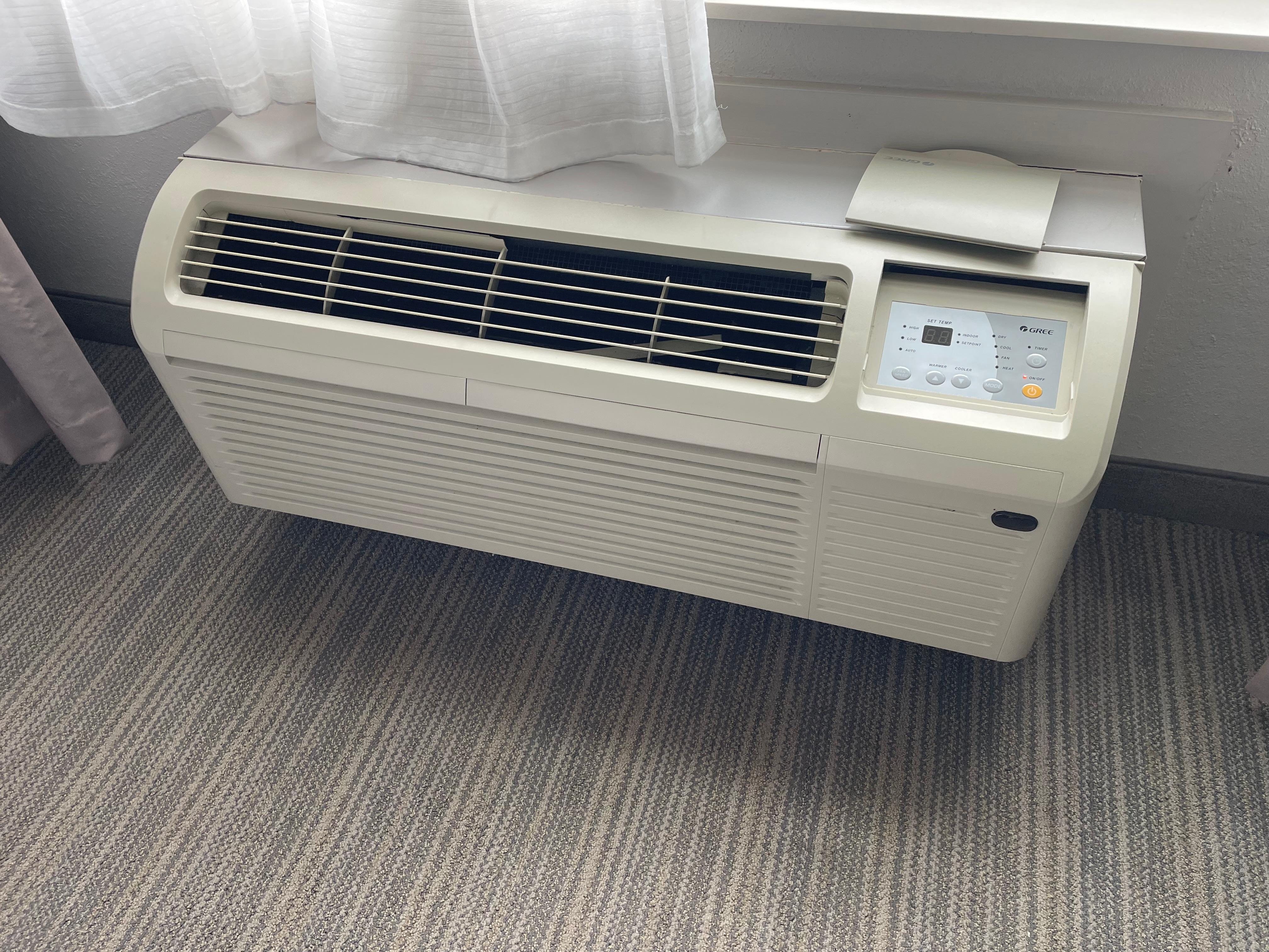 Broken/missing pieces on air conditioner that also emitted urine smell. 