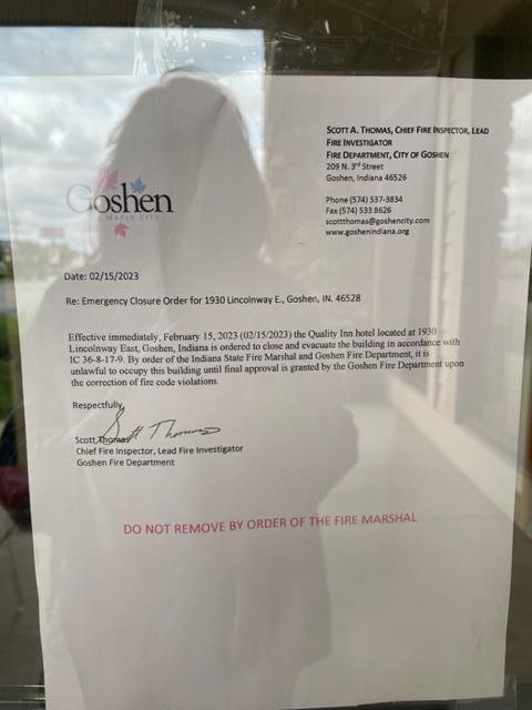 SIGN ON DOOR SAYING THE HOTEL HAS BEEN CLOSED