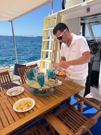Morning coffee in shaded sitting area with ceiling fan to stay cool