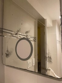 Rusty mirror bathroom.