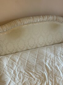 Pillows covered the headboard on arrival. Had we known it was this dirty, we would have asked to change rooms.