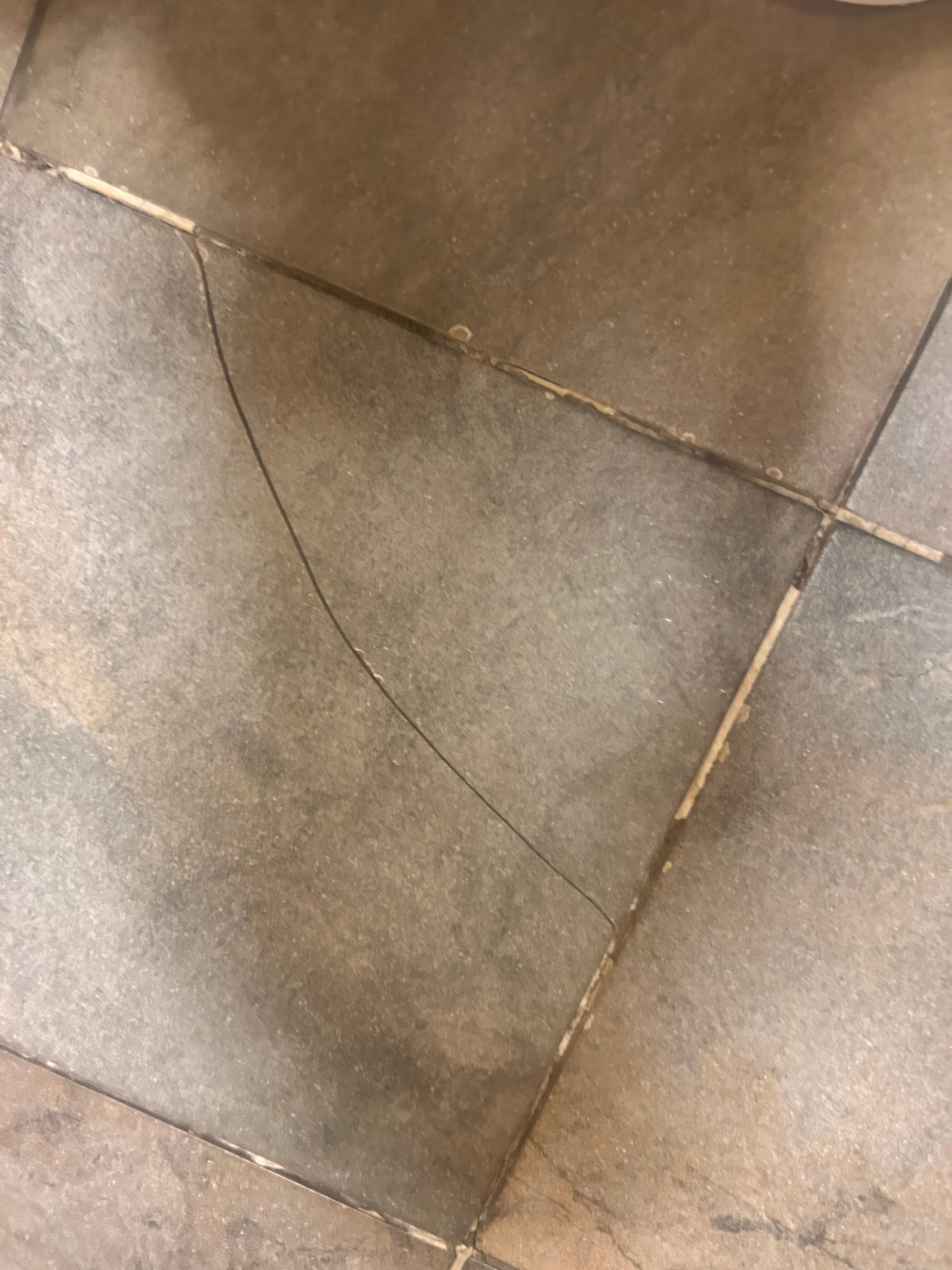 Crack in bathroom tile, someone can cut their feet