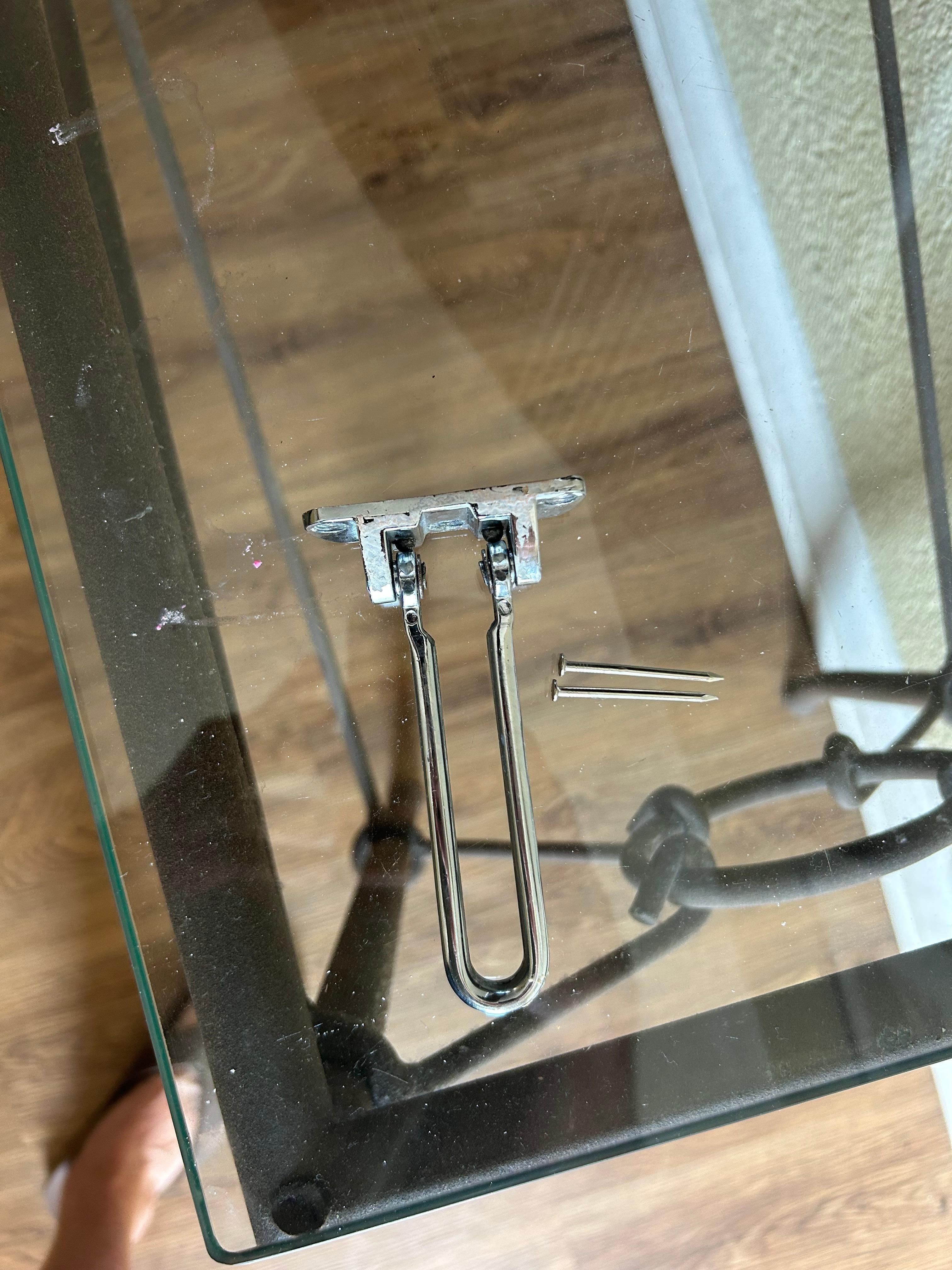 Latch with tiny nails waiting for install