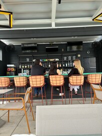 The pool area has food and drinks available.