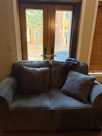 This door didn’t lock & no one came to fix it.I had to wrap cords around the door knobs.There’s also no curtain so you visibly can see inside from outside. We pushed the couch in front of the door as well.There’s a screen that doesn’t close also.