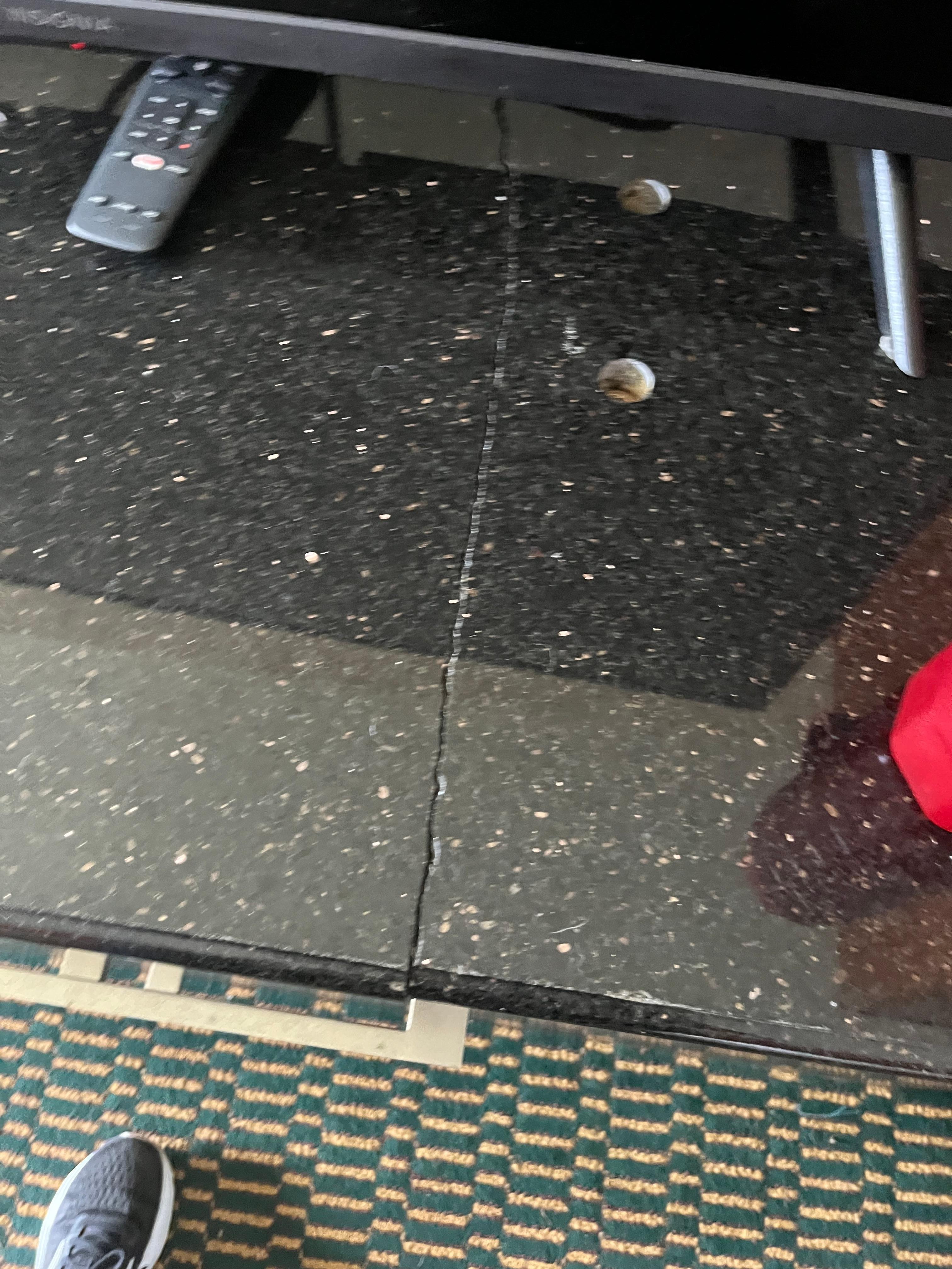 The desk had a huge crack which isn’t the end of the world but the desk had a film on it and had like sticker glue on it or something like that. 