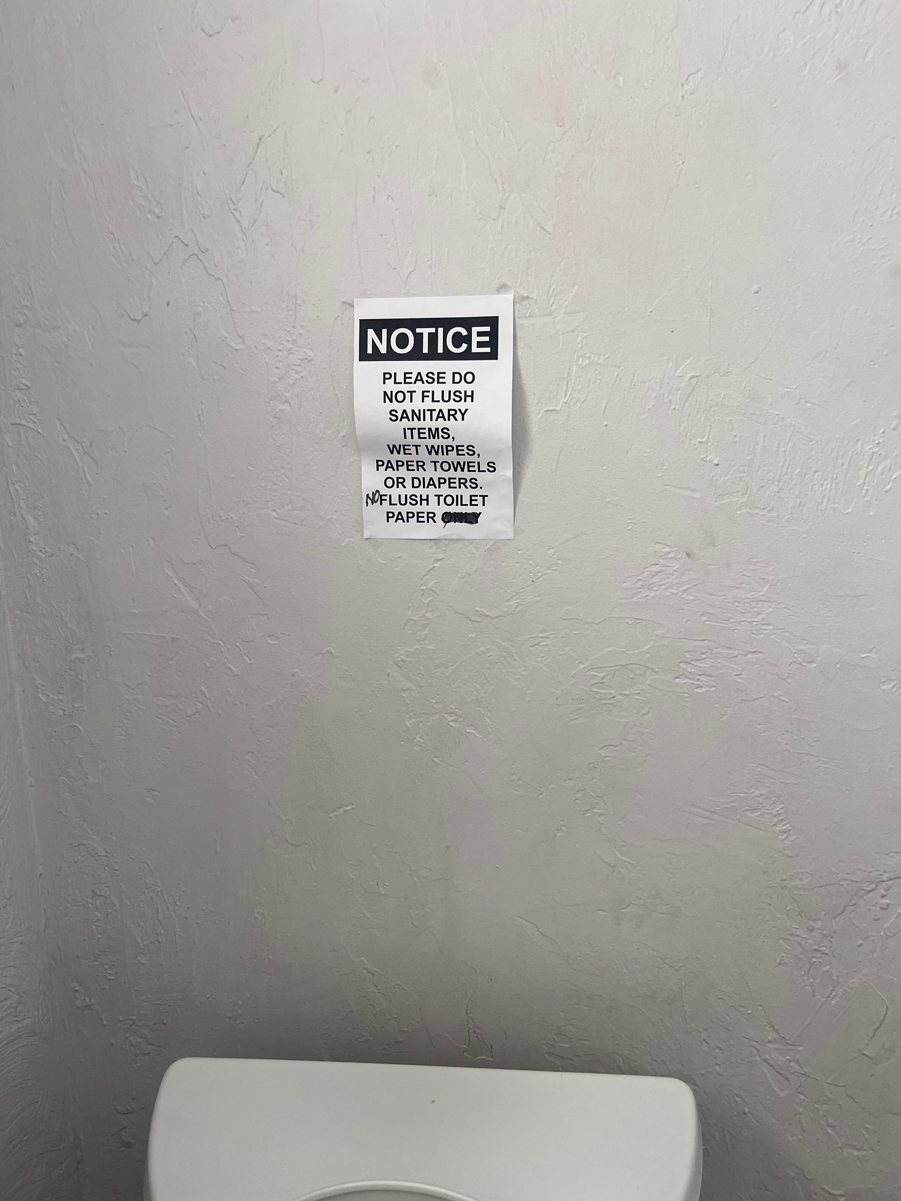 You can see where the homeowner changed the signs to no flushing toilet paper. 