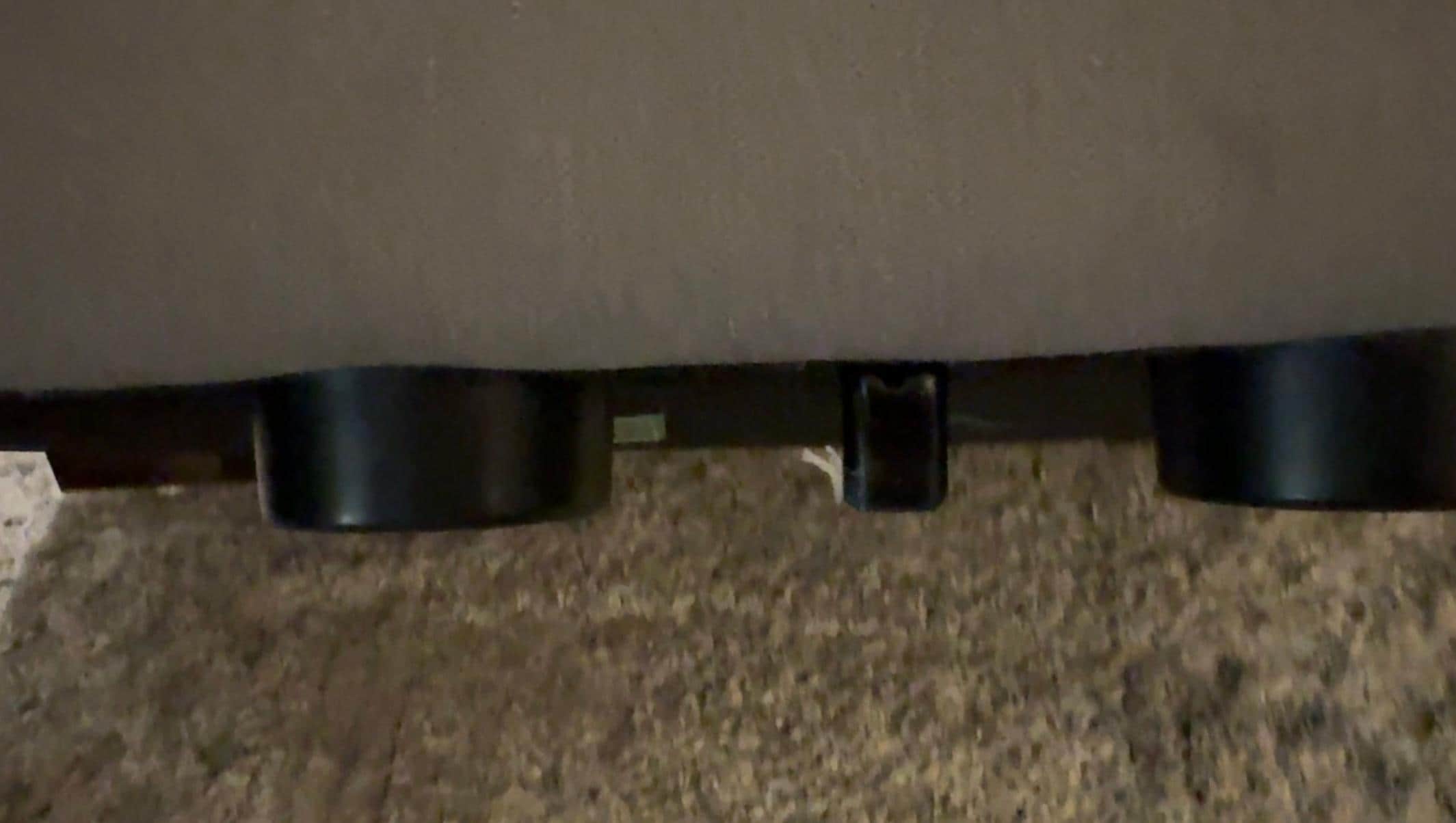 Sharp metal piece sticking out from ottoman with a chunk of skin still on it from injured guest