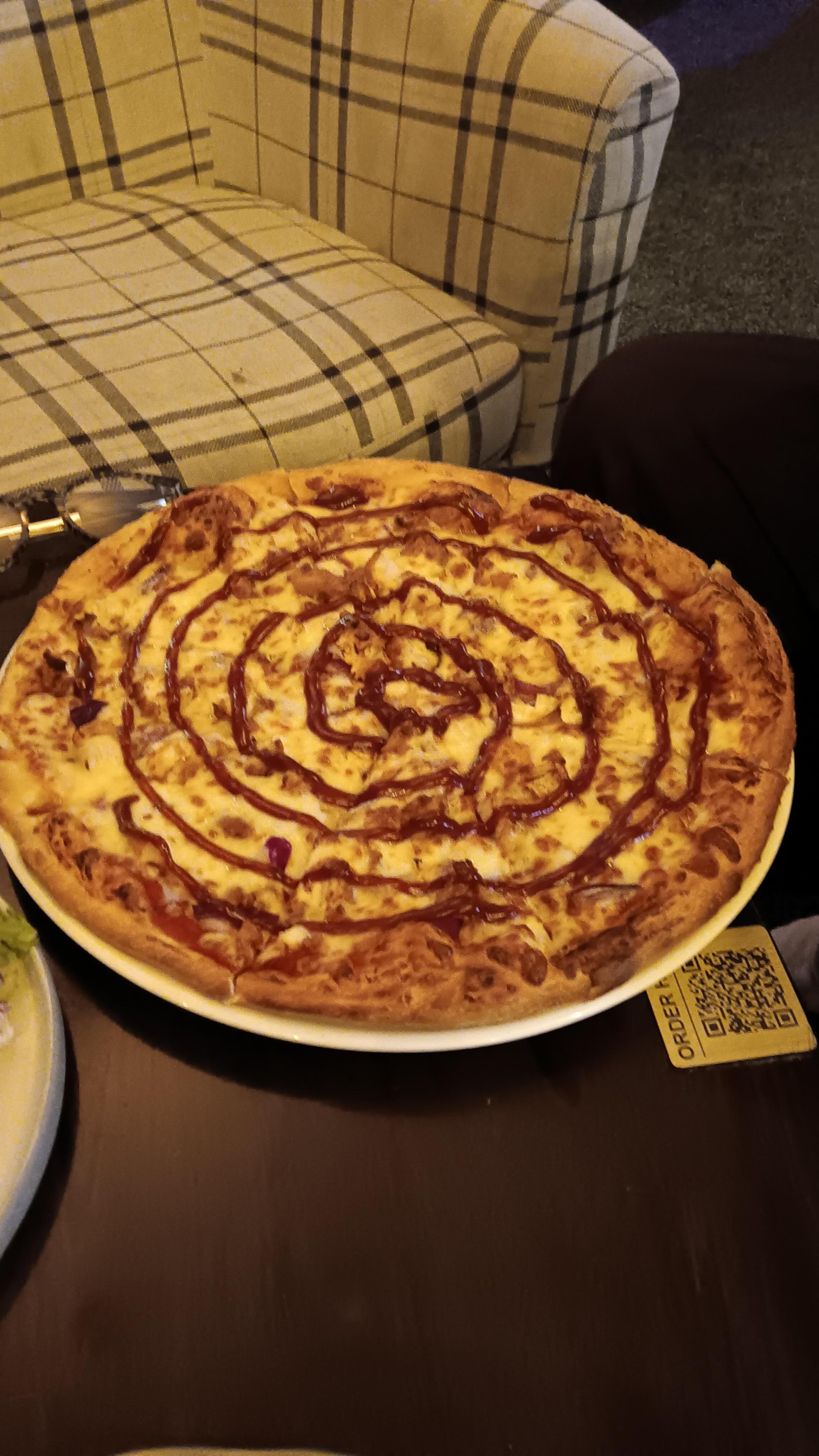 The BBQ chicken pizza my partner ordered along with Chicken wings was delicious.