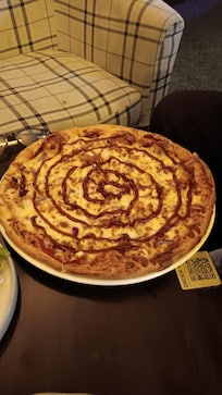 The BBQ chicken pizza my partner ordered along with Chicken wings was delicious.