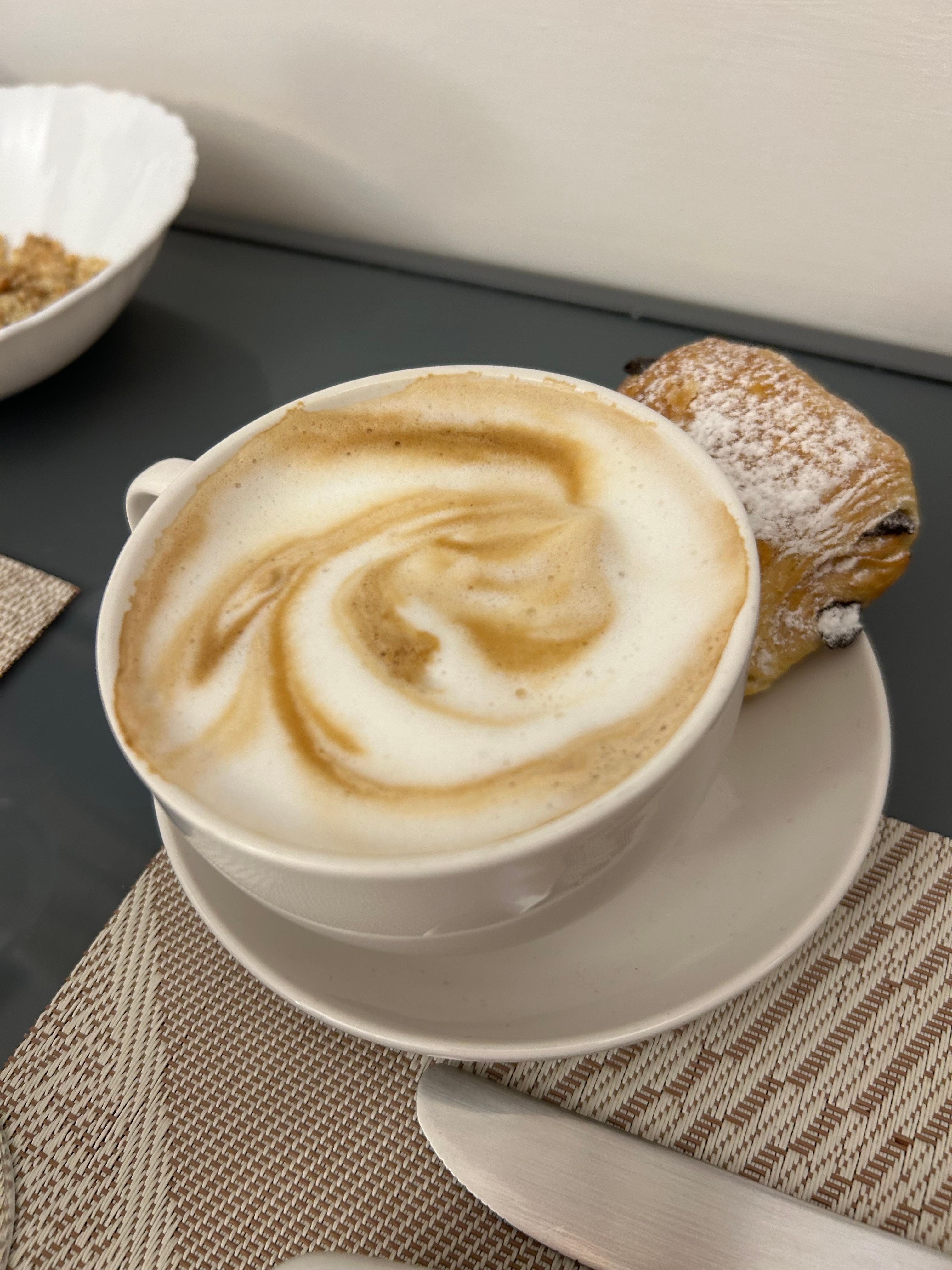 Breakfast cappuccino and pastry