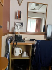 Everything in one place, including hair dryer, hand mirror and ironing board