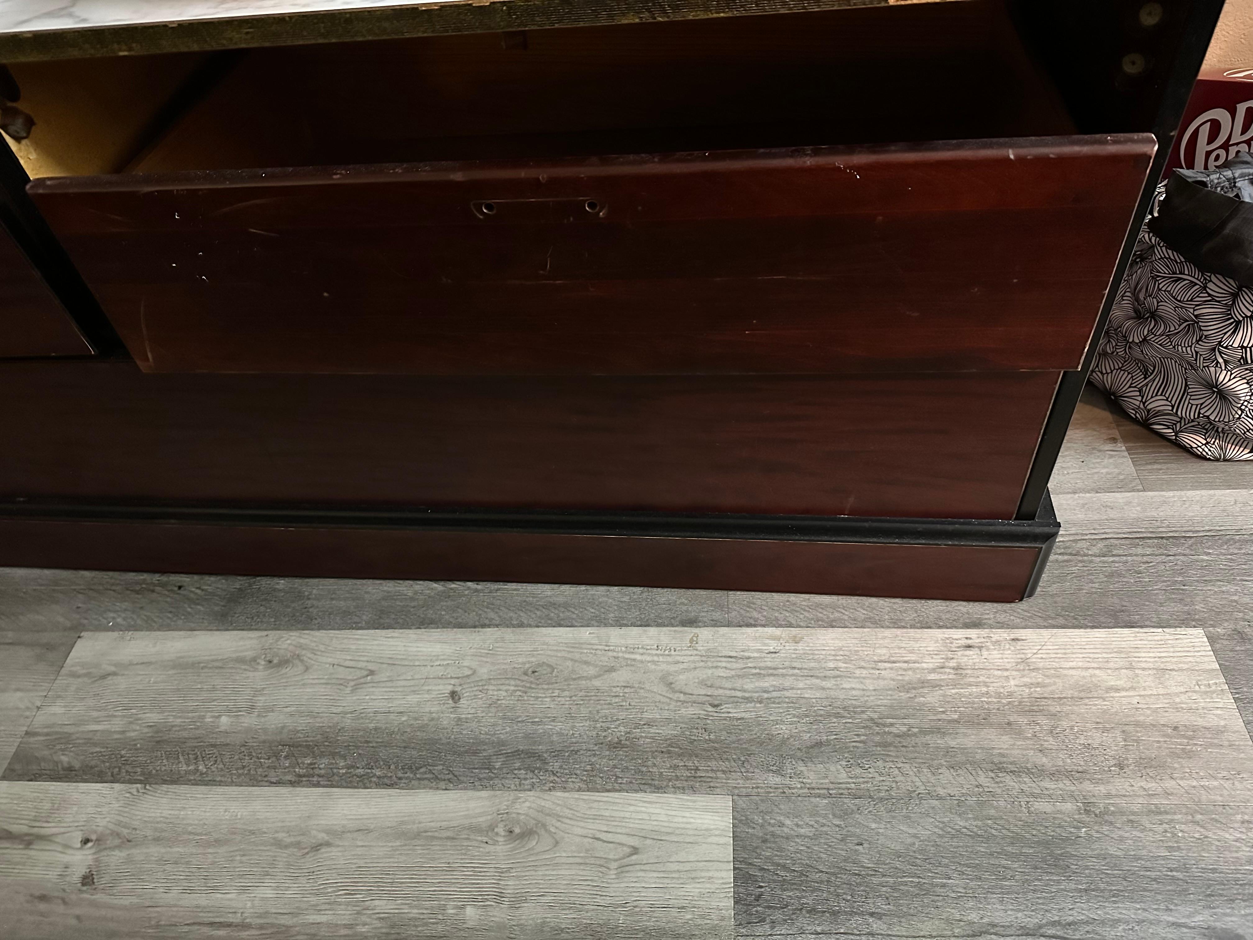 Random drawer sitting on top of bottom drawer