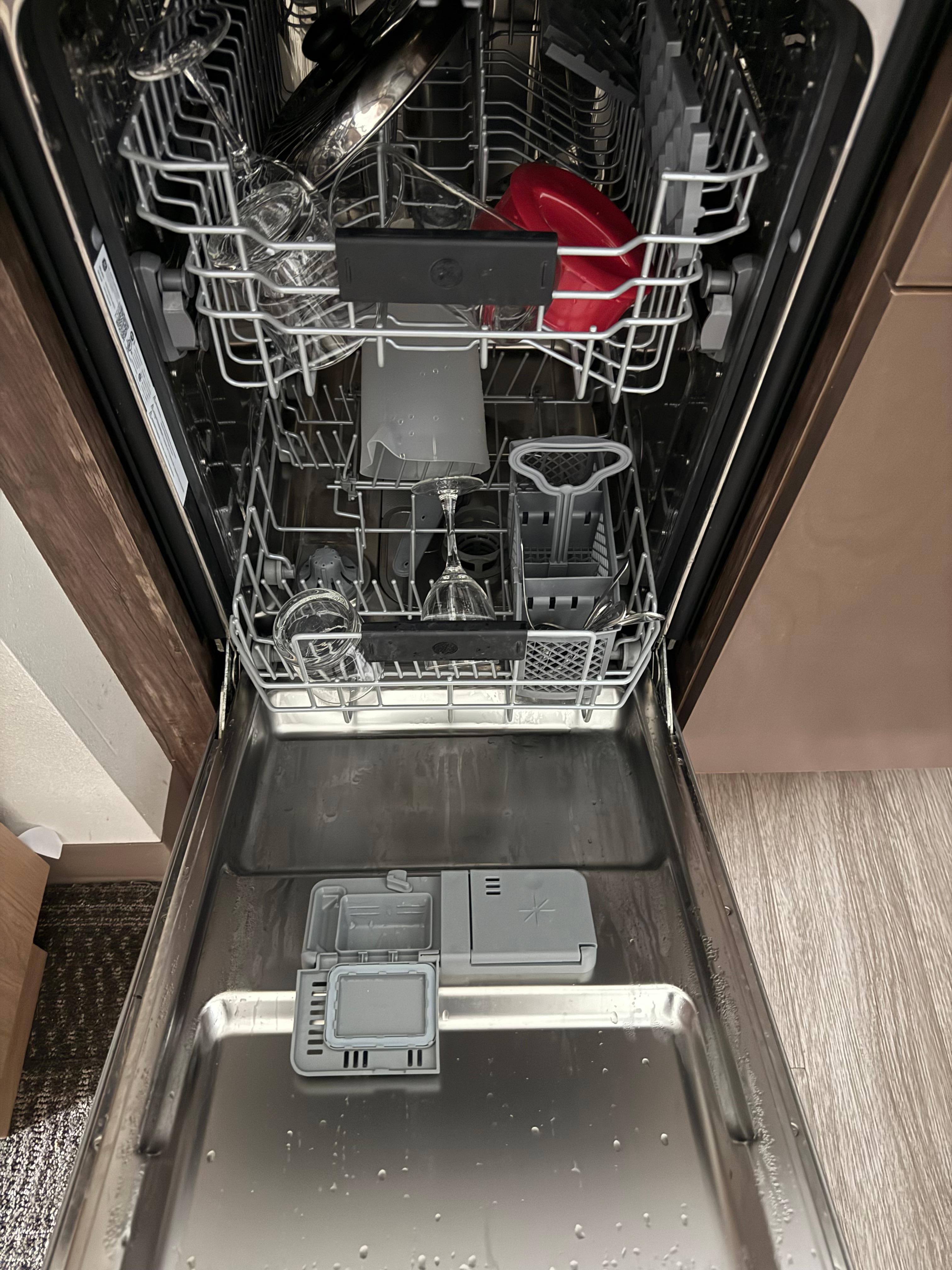 Dishwasher full of dirty dishes