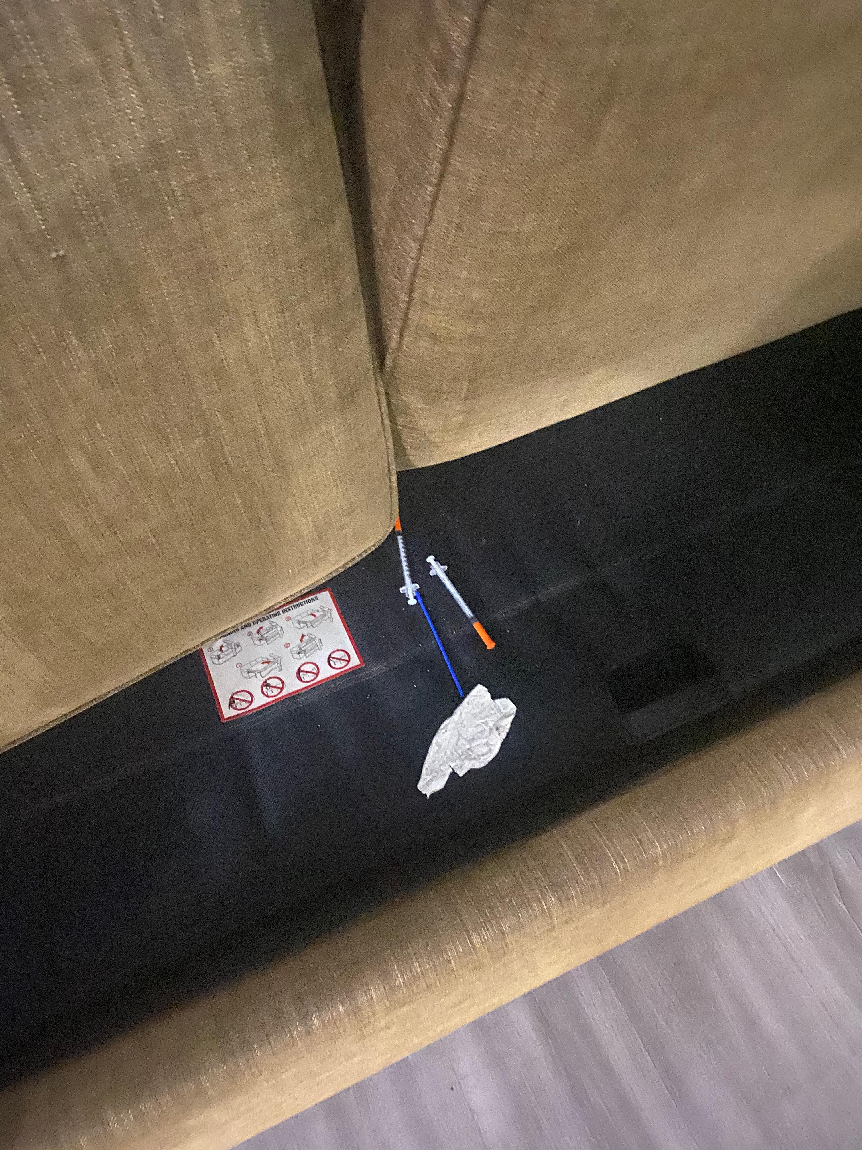 Drug needles under couch seats