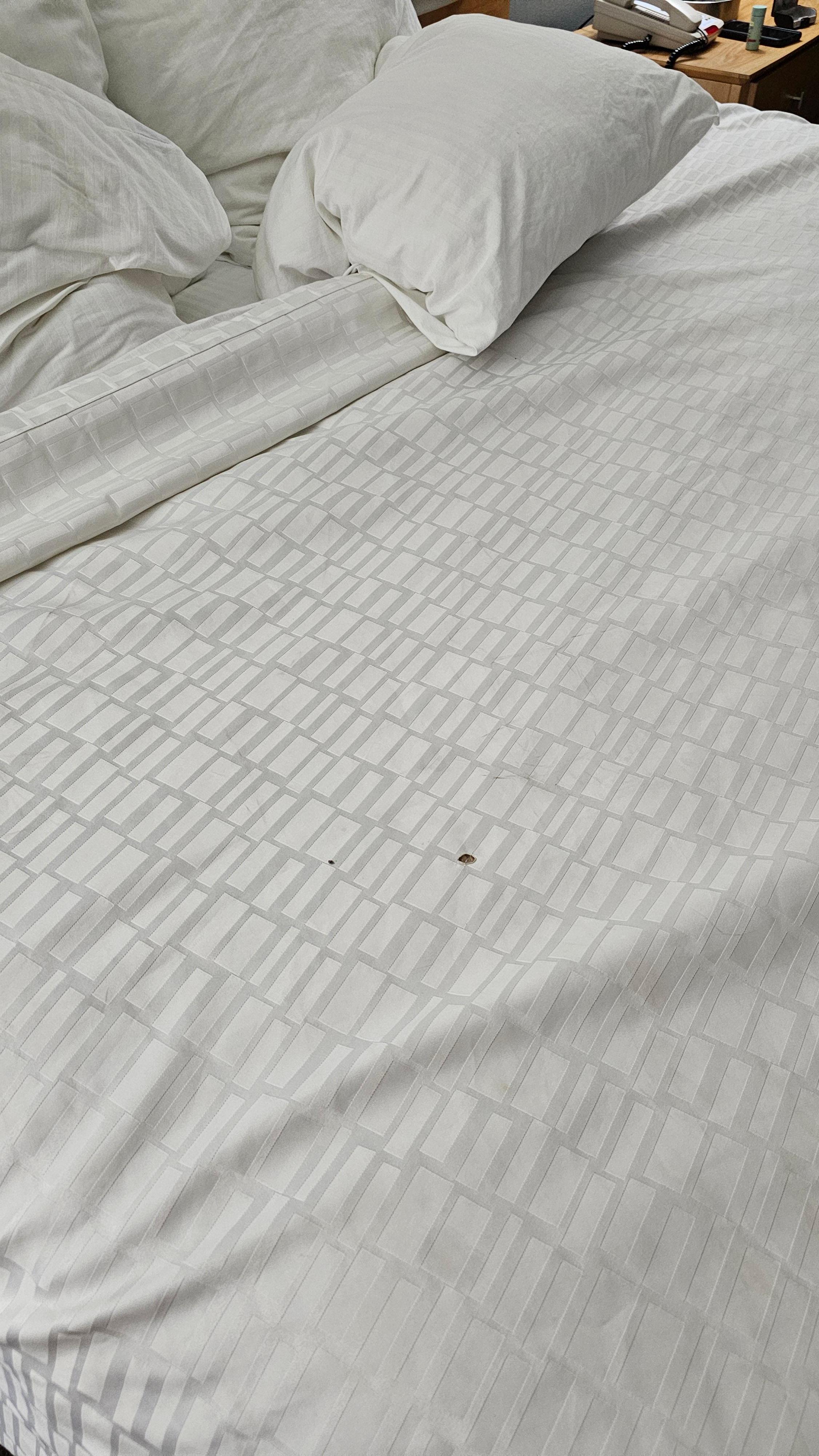 Bedspread with cigarette holes