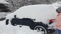 Snowed up car, owner borrowed us a shovel and broom to clean it!