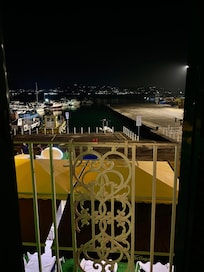 Photos taken from balcony. The gold roofs are restaurants with excellent fresh seafood dishes.