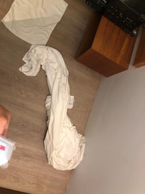 Smelly bedsheet leave on floor.
