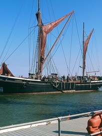 The view of the sailing barges while sitting outside enjoying a nice cold glass of wine what more can you ask off.