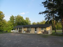 Multi-unit and single cabins are toward back of property