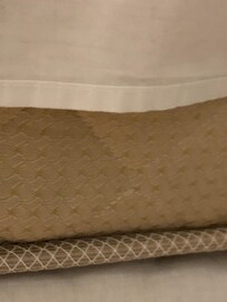 Ill-fitting bottom sheet which did not cover the disgusting mattress