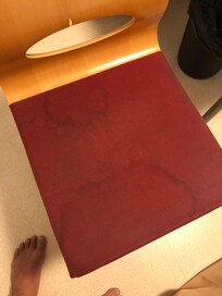 Chair in the room, unidentifiable stains