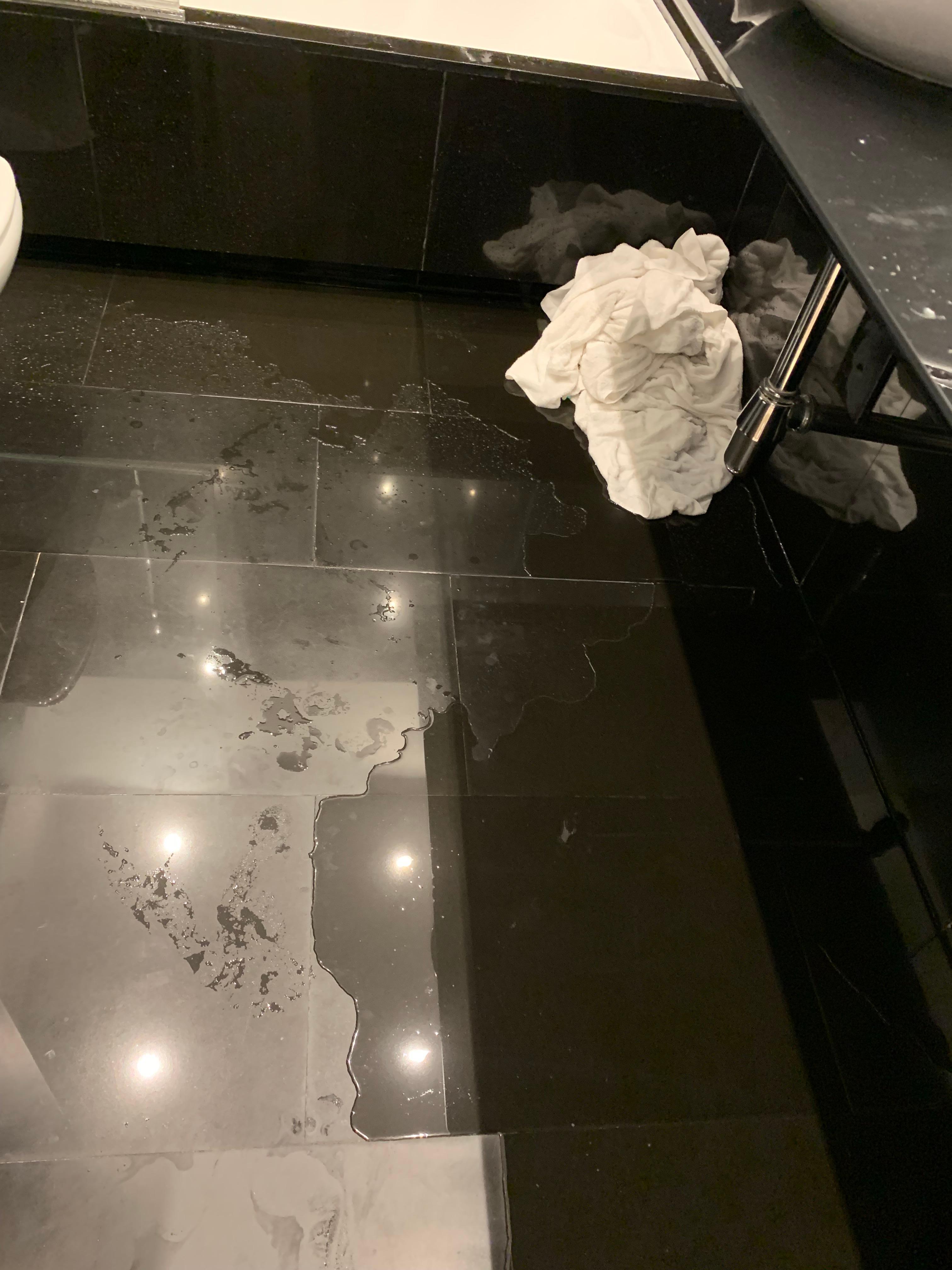 Overflowing water on the floor during shower. 