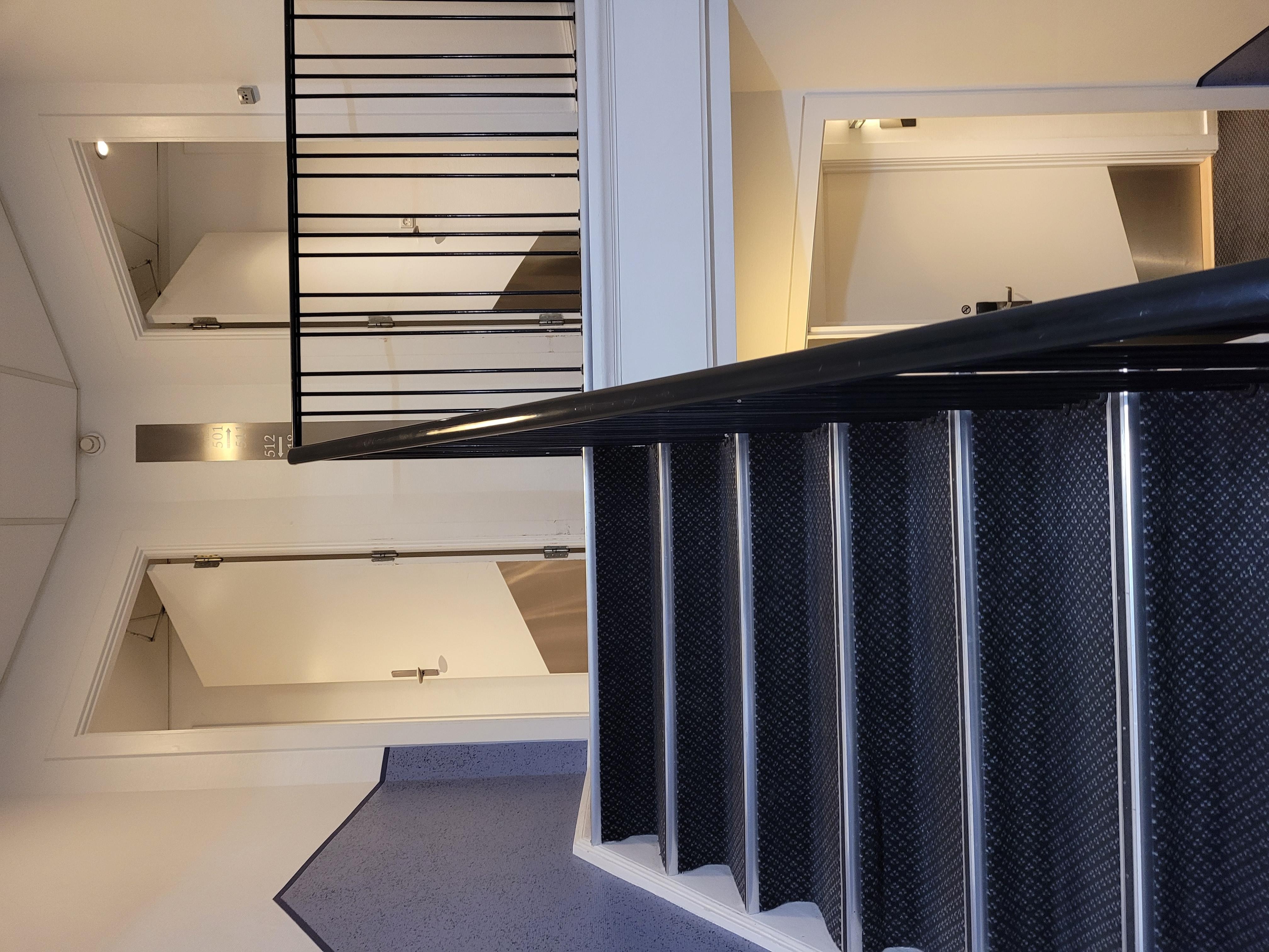 Elevators are located between floors.