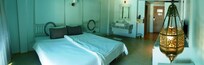 Panorama from the balcony door. Note the "headboard" for the far bed, now offset.
