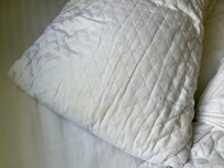 Brown stains on the pillow protector I wonder what it could be ?