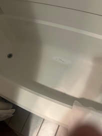 Bathtub had two areas of damage that had been epoxied but probably should've been replaced....