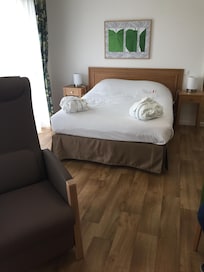 Large comfortable bed with dressing gowns provided