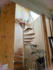 Cute staircase. 3 story room.