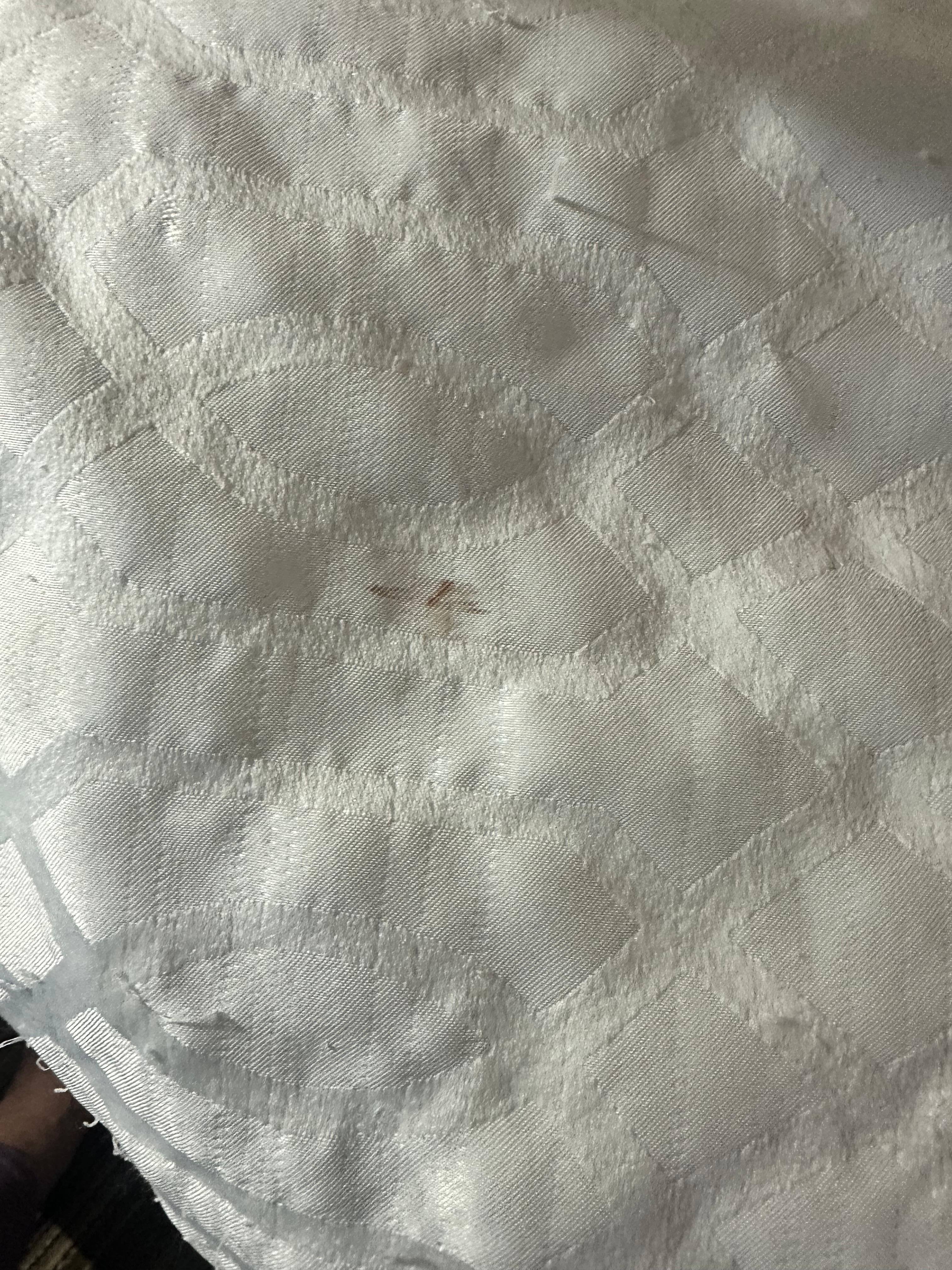 Snagged bed coverlet 