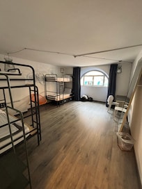 Six bed room, partly divided into two sections.