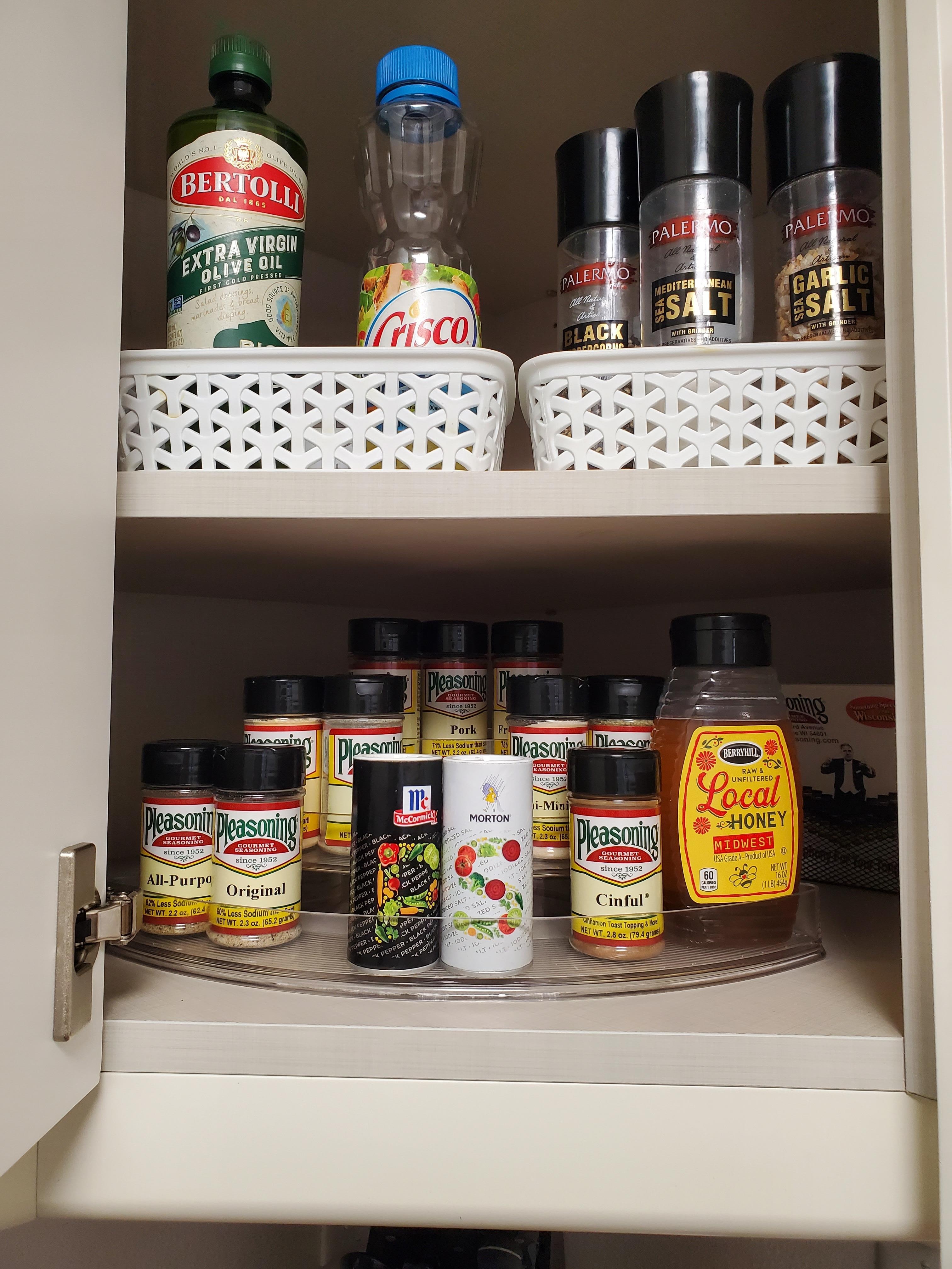 Many spices, coffee, sugar, and water in the fridge