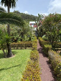 View of the villa from the lush garden.
