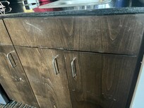 Scratches on cabinet doors in kitchenette
