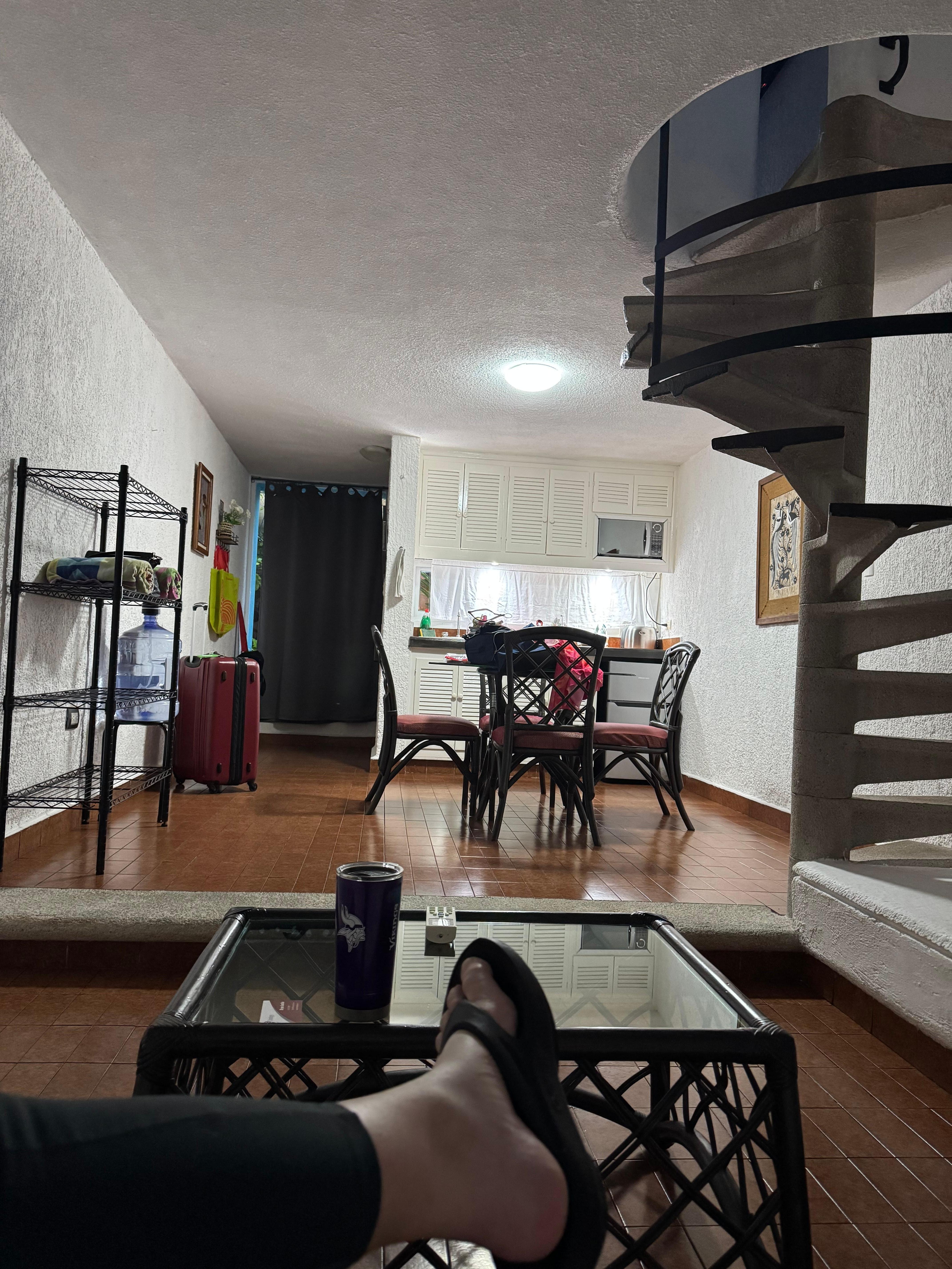 Upstairs has the bathroom, bed area, two closets with robes and phone charger plugs/plug ins behind the pillows for convenient use