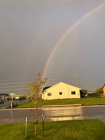 Rainbow after the storm looking east from the front porch
