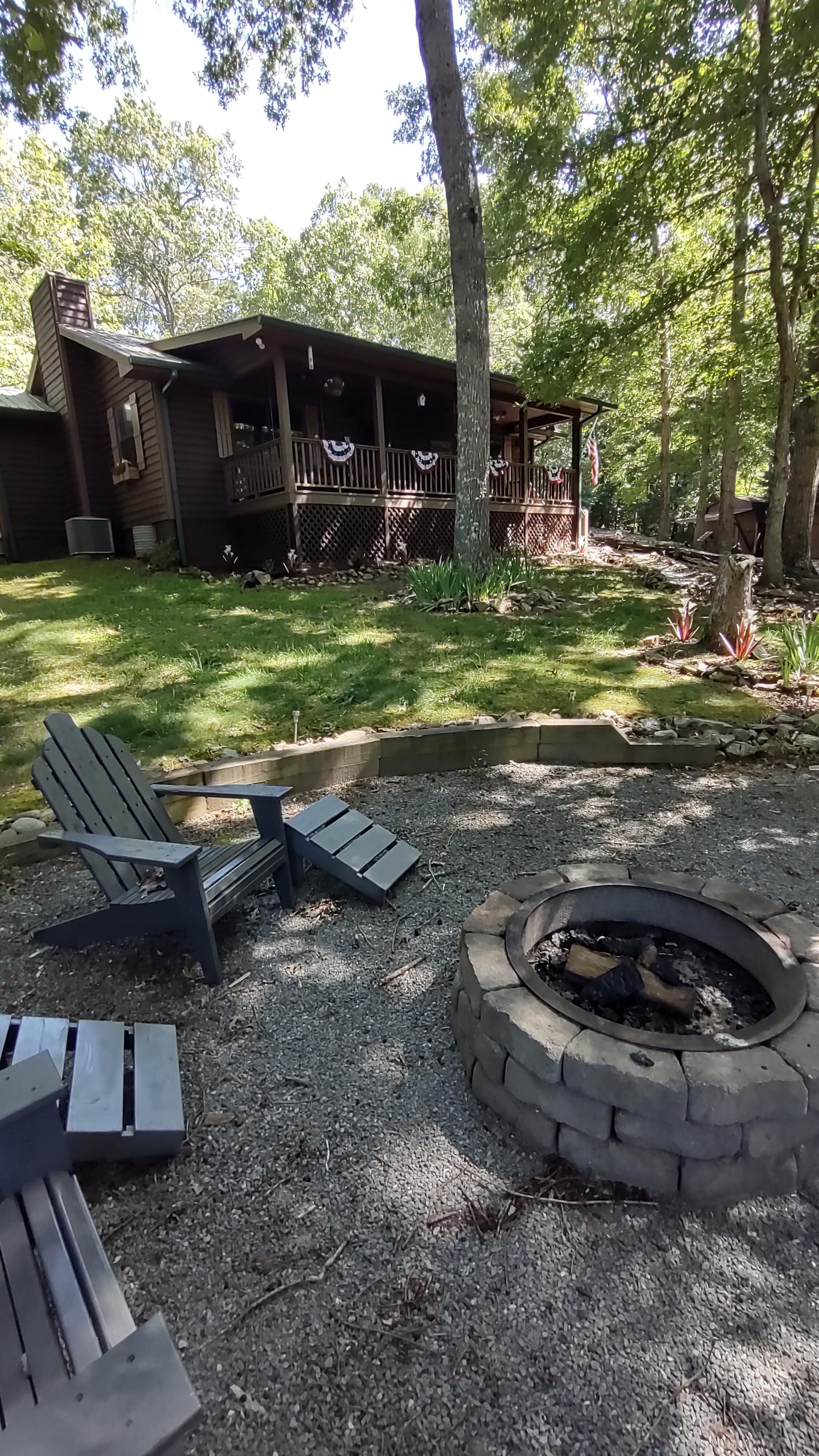 Fire Pit/Conversation Pit
under the front yard trees! Very nice.