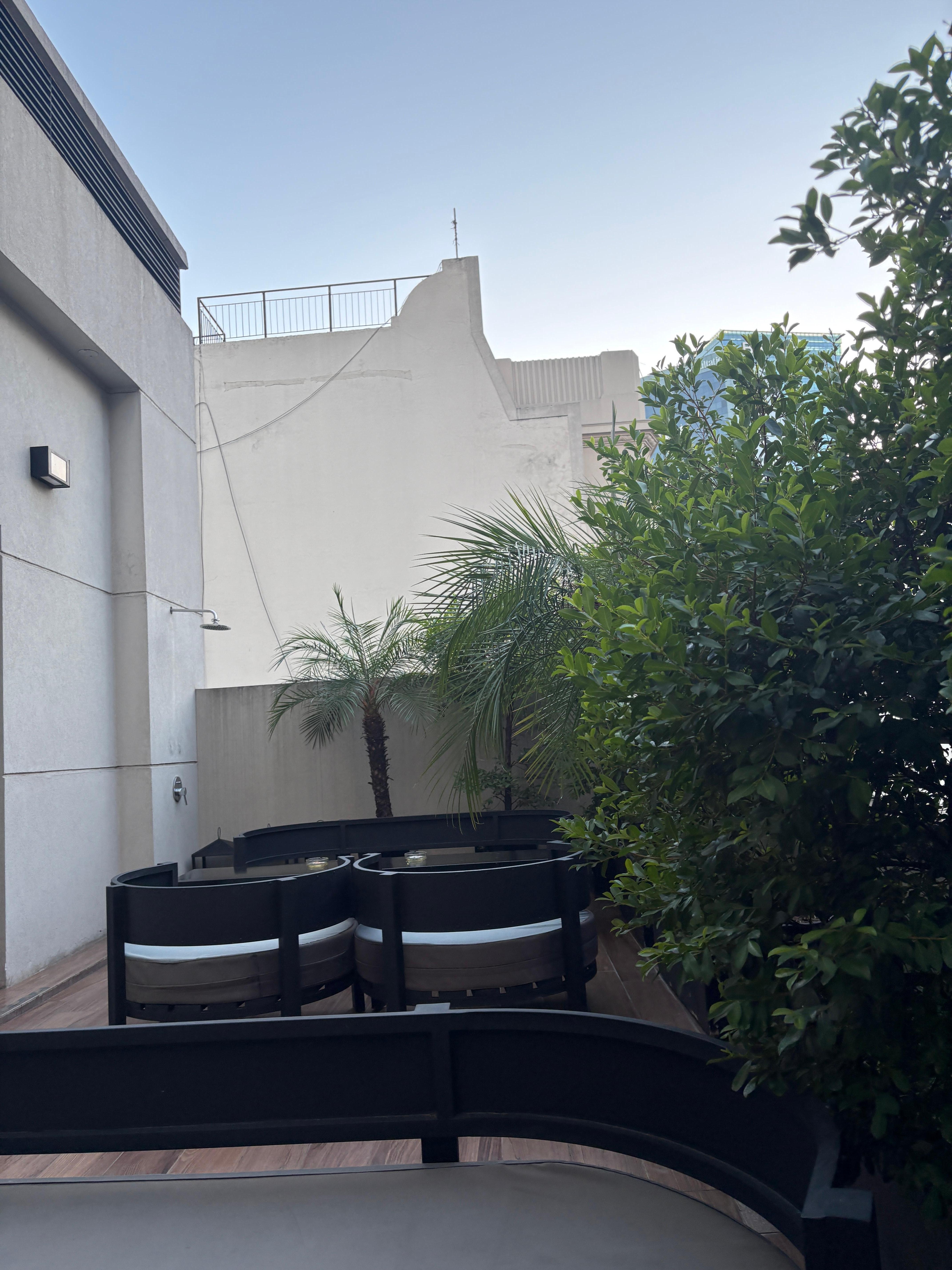 Outside smoking area of the hotel ( very clean and well maintained)